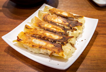 Crispy fried dumplings placed on restaurant's table