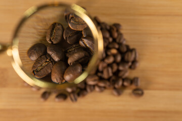 Coffee beans under a large magnifier top view for background