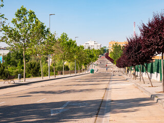 People walking and playing sports on a closed road for the exclusive use of pedestrian use during the coronavirus alarm state