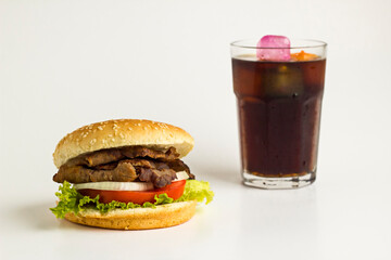 Delicious Burger made with Traditional Turkish Doner Kebab,tomato,pickle,lettuce and onion rings on...