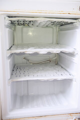 Dirty, unwashed and frosty refrigerator. Violation and non-compliance with sanitary and...