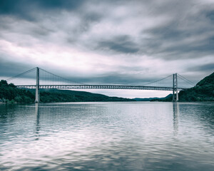 A overcast winter view of the Bear Mountian Bridge and the Hudson River.
