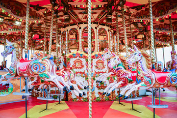 Empty colorful Merry-Go-Round (Carousel) with Horses Empty in a Circus Show