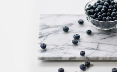 Fresh blueberries background with text copy space. Blueberry organic superfood berries in a bowl concept for healthy eating 