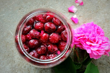 Closeup cherry jam in a jar, harvesting for winter, selective focus.