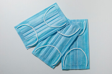 blue clinical face masks on a white background 