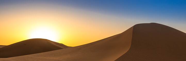 Fototapeta na wymiar Merzouga in the Sahara Desert in Morocco. Web banner in panoramic view.