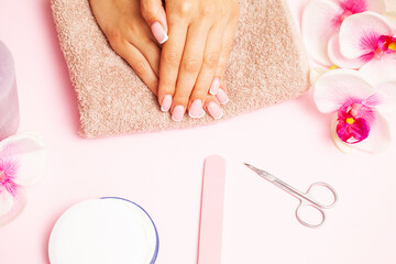 Beautiful woman hands with fresh french manicure