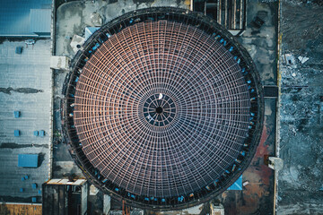 Above round iron roof of unfinished nuclear power plant, circle metal construction, industrial...