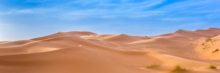 Fototapeta premium Merzouga in the Sahara Desert in Morocco. Web banner in panoramic view.