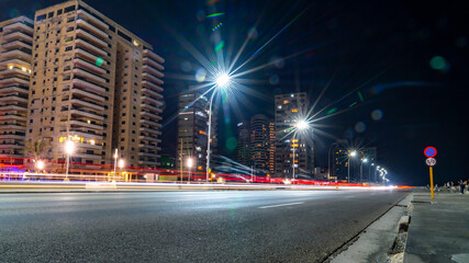 Night in Old Havana with the street lights of El Malecon. Latin, cityscape. Long exposure with light lens flares.