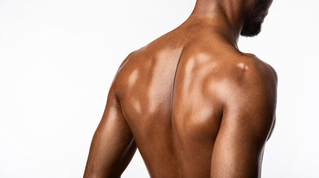 Unrecognizable Black Bodybuilder Posing Back To Camera In Studio, Panorama