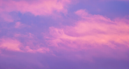 pink clouds in blue sky background