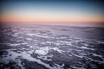 Aerial view of rocky winter landscape during sunset