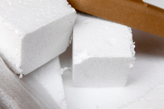 Polystyrene and recycled cardboard stacked ready for garbage collection.