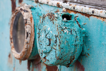 Rusty, grunge, chippy paint on old rail car with many coats of pealing paint