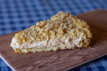 white cream cake on wooden board