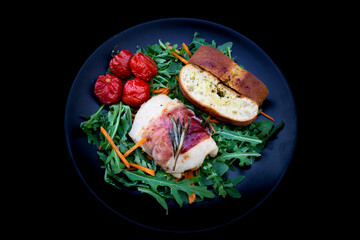 Chicken breasts filled with creamy parmigiana stuffing and wrapped in prosciutto
