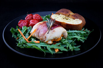 Chicken breasts filled with creamy parmigiana stuffing and wrapped in prosciutto