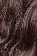 Single piece clip in wavy dark brown synthetic hair extensions
