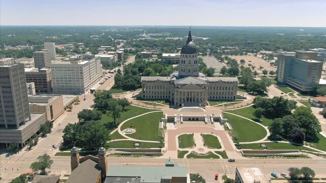 Aerial flying over Kansas State Capitol building & downtown Topeka. Kansas, USA