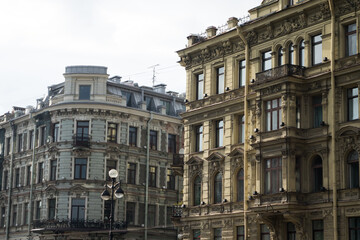 Fototapeta na wymiar a corner side by side of two typical classic buildings of Saint Petersburg on Nevsky prospect