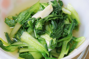 Close up view of Pak Choi in a white plate   