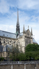 Fototapeta na wymiar Notre Dame de Paris in a beautiful summer day. Side shots on the church's peak