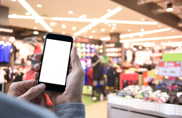 Mockup of man using mobile smart phone in shopping mall or department store