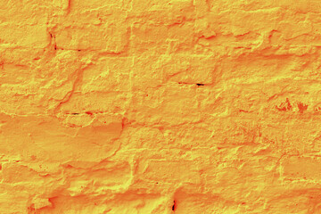 Saffron color plastered brick wall texture.