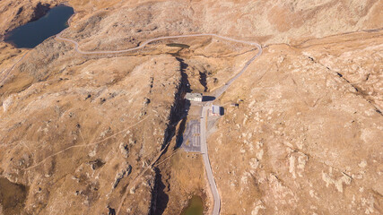 Drone aerial view of the Gavia mountain pass in Italy. Fall season. Italian Alps. Famous biker destination. Restaurants and Lodges closed for the winter season. Nobody in the area