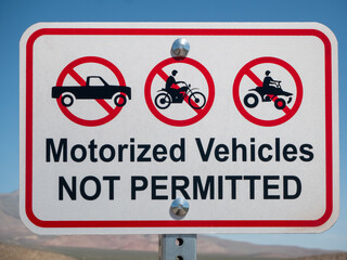 No motorized vehicles sign along a desert hiking and bicycling trail. © J Gillispie