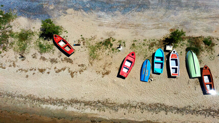 Aerial shot of fishing boats on the beach in Halkidiki Greece