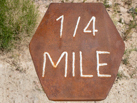 Rusted Hexagon Shaped Hiking Trail Mile Marker.