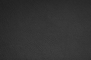Black leather texture can be used as background. Artificial leather close-up