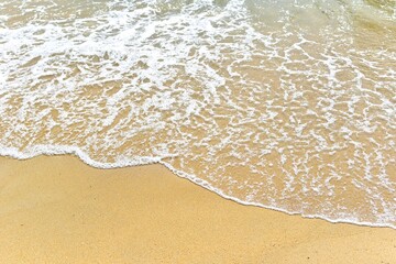 Waves splash on the beach