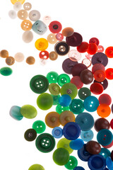Wallpaper of various size and color vintage buttons. White isolated background.  Colorful...