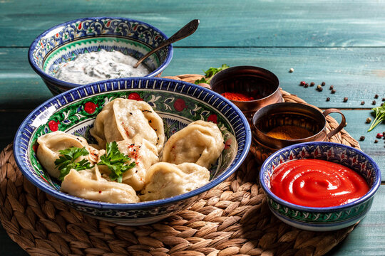 Uzbek dumplings called chuchvara. Asian ravioli with minced Meat pelmeni, gyoza, dim sum, jiaozi, momo, tortellini, pierogi, varenyky or mandu