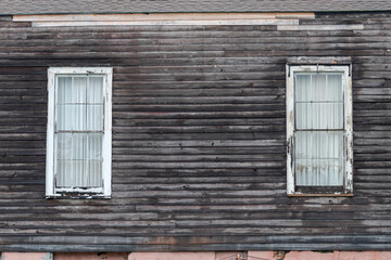 Old wooden window on an old wooden wall