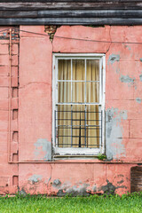Fototapeta na wymiar Old wooden window on a pink wall background