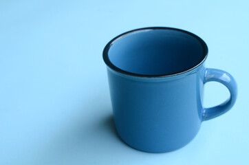 blue mug mock-up on blue background. empty space