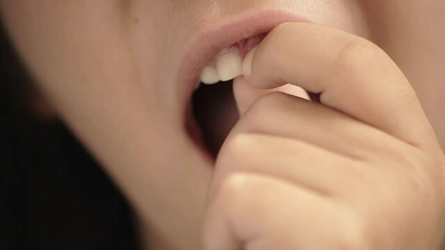 Girl Pulling Falling Baby Tooth