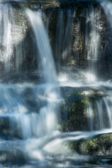 Broad Brook cascades over a waterfall in East Windsor, Connecticut.
