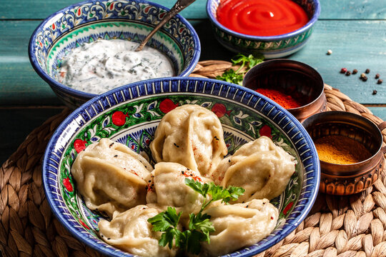 Uzbek prepared boiled Manti or manty. Chuchvara dumpling typical of Central Asian cuisine, small Uzbek dumplings