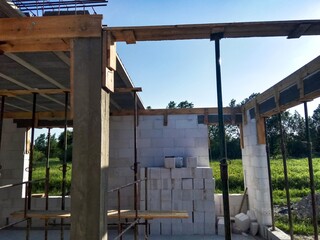 Building of detached house in Poland. Construction of detached house. House construction site. Construction of walls. Aerated concrete blocks. Inside of builded house.