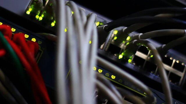 Working Ethernet switch close up. Blinking LED. 10/100/1000 Mpbs speed. Fully loaded and working fast. Top technology clip.