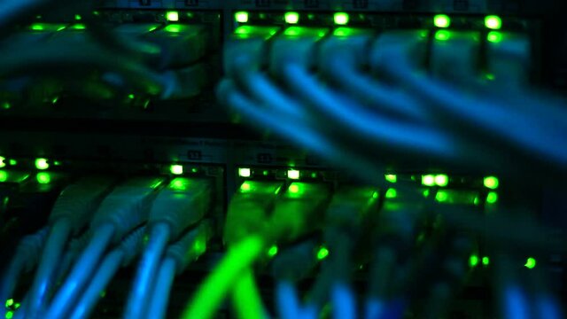 Working Ethernet switch close up. Blinking LED. 10/100/1000 Mpbs speed. Fully loaded and working fast. Top technology clip.