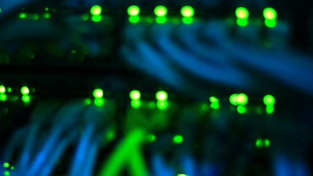 Working Ethernet switch close up. Blinking LED. 10/100/1000 Mpbs speed. Fully loaded and working fast. Top technology clip.