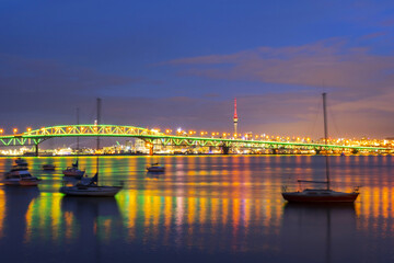 Night View to the Iconic Harbour Bridge Auckland New Zeland; Light Performance seeing from Birkenhead Wharf