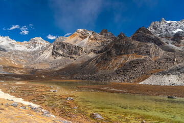 Fototapeta premium Small lake surrounded by Himalaya mountains range after crossing Renjo la pass, Everest base camp trekking route, Nepal